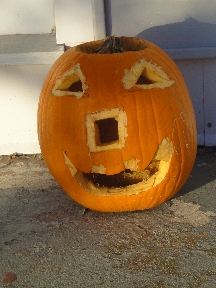 Shoghi's carved Halloween pumpkin on the door stoop